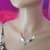 Silver Sculpted Angel Wings Crystal Drop Necklace