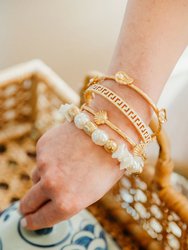 Scallop Shell Bangle in Worn Gold