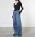 Soft Touch Pleated Wide Leg In Mid Wash