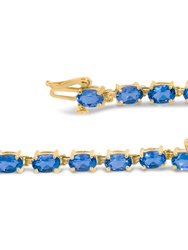 10K Yellow Gold and 4 Prong Set 6X4 MM Blue Topaz Link Tennis Bracelet - Size 7"
