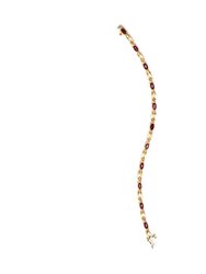 10K Yellow Gold Oval Ruby and 1/10 Cttw Diamond Bar Prong Set Bracelet (H-I Color, SI1-SI2 Clarity) - Size 7"