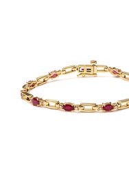 10K Yellow Gold Oval Ruby and 1/10 Cttw Diamond Bar Prong Set Bracelet (H-I Color, SI1-SI2 Clarity) - Size 7" - Yellow Gold