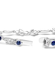 18K White Gold 1 3/4 Cttw Diamond and 3x3mm Round Blue Sapphire Gemstone Floral Link Bracelet (G-H Color, SI1-SI2 Clarity) - Size 7"