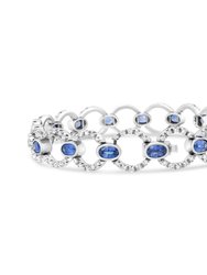 18K White Gold 6 Cttw Diamond and 5x3mm Oval Blue Sapphire Openwork Circle Link Bracelet (F-G Color, SI1-SI2 Clarity) - Size 7"