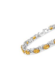 .925 Sterling Silver 7 x 5 Mm Oval Cut Orange Citrine And 1/20 Cttw Round Cut Diamond Fashion Tennis Bracelet