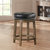 Paran 25 in. Brown Backless Wood Frame Round Swivel Bar Stool with Faux Leather Seat - Set of 2