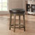 Paran 25 in. Brown Backless Wood Frame Round Swivel Bar Stool with Faux Leather Seat - Set of 2