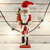 Ornativity Gift Santa Nutcracker –Nutcracker Santa in Traditional Attire with a Bag of Gold Wrapped Gifts Over His Shoulder and List of Names in Hand