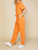 Short Sleeve Gauze Jumpsuit In Orange